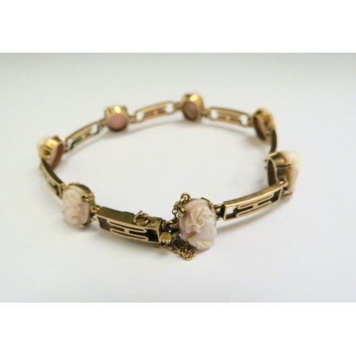 9085 - A gold bracelet spaced with seven cameo ovals, stamped 9ct, 18cm long, 9.3g  (C)