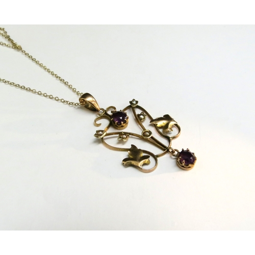 9066 - A gold chain stamped 9kt, 40cm long hung with a gold pendant with seed pearl and amethyst coloured s... 