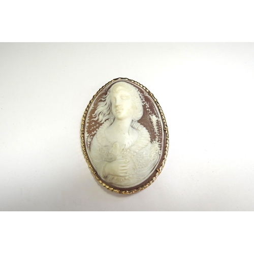 9070 - A finely carved shell cameo brooch depicting bust length image of female holding flower, stamped 14k... 