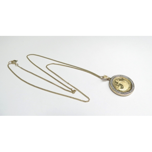 9055 - A 2008 Britannia gold and diamond pendant hung on a 9ct gold chain, 44cm long, 6.9g