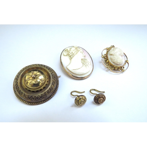 9127 - Two cameo brooches with 9ct gold frames and a Victorian brooch with a pair of similar earrings