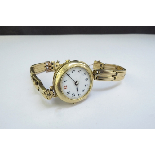 9087 - An 18ct gold wristwatch, no glass, dented, 32.5g