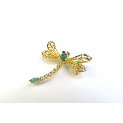 9130 - A gold dragonfly brooch/pendant unmarked, with ruby set eyes, cabochon jade and diamond wing tips an... 