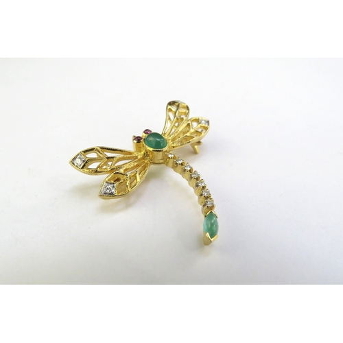 9130 - A gold dragonfly brooch/pendant unmarked, with ruby set eyes, cabochon jade and diamond wing tips an... 