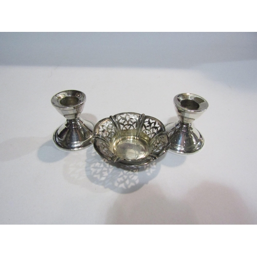 4309 - A pair of small white metal candlesticks and a Continental basket (3)