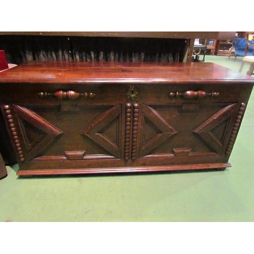 4003 - An 18th Century and later oak two panel coffer the hinged lid and moulded front over stile feet, 52c... 