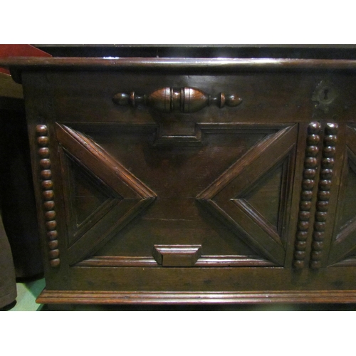 4003 - An 18th Century and later oak two panel coffer the hinged lid and moulded front over stile feet, 52c... 