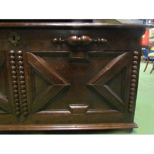 4003 - An 18th Century and later oak two panel coffer the hinged lid and moulded front over stile feet, 52c... 