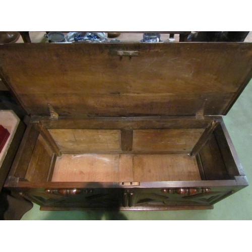 4003 - An 18th Century and later oak two panel coffer the hinged lid and moulded front over stile feet, 52c... 