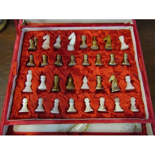 4016 - A cased onyx chess set and board, some pieces a/f, board size 40.5cm x 40.5cm