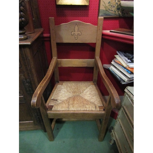 4039 - A pair of oak carver dining chairs with rush seats    (E) £15-20