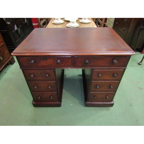 4070 - A mid Victorian mahogany twin pedestal desk the round cornered top over eight drawers on a plinth ba... 