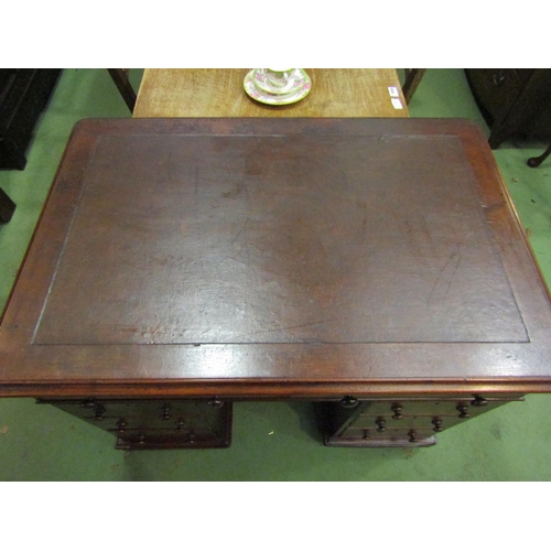 4070 - A mid Victorian mahogany twin pedestal desk the round cornered top over eight drawers on a plinth ba... 