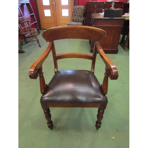 4071 - A Victorian style walnut desk armchair with scroll arms over turned and tapering fore legs