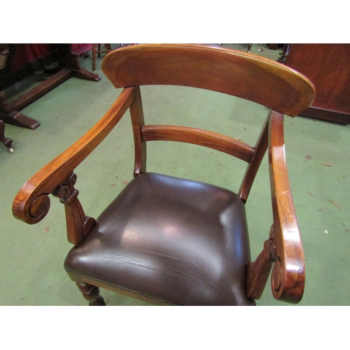 4071 - A Victorian style walnut desk armchair with scroll arms over turned and tapering fore legs