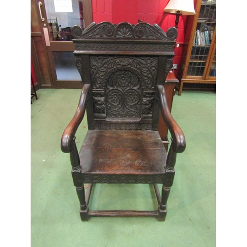 4093 - A 17th Century Wainscott chair with carved back on stretcher base, 120cm tall