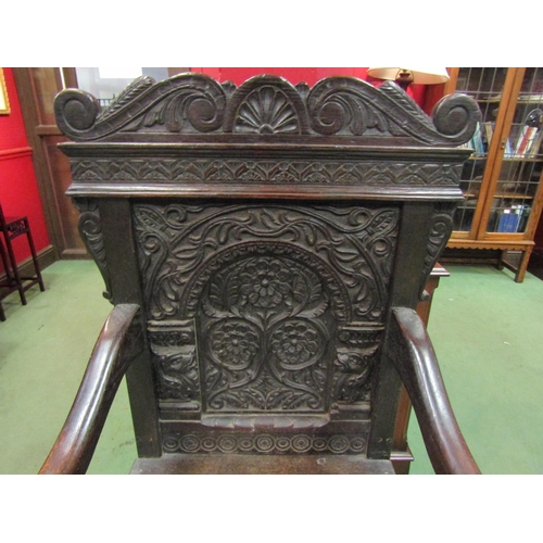 4093 - A 17th Century Wainscott chair with carved back on stretcher base, 120cm tall