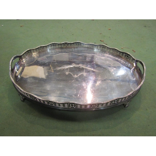 4097 - A large twin handled footed silver plated galleried tray with ribbon and swag detail, 56cm long