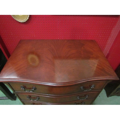 4109 - In the manner of Bevan funnell a George III style flame mahogany serpentine front chest of four draw... 