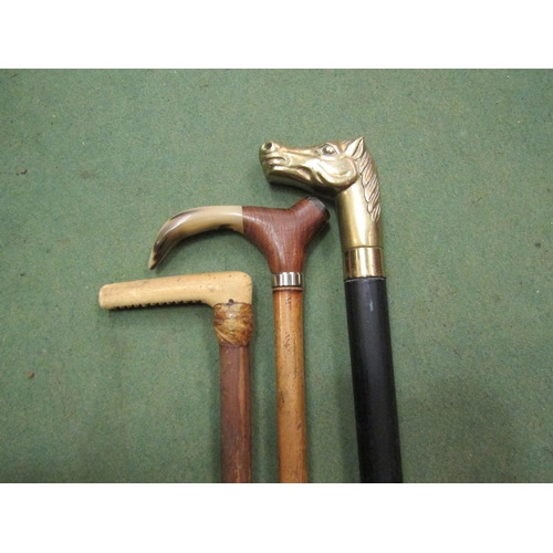 4111 - Two horn handled walking sticks, brass horse head handled walking stick with test tube flask to inte... 