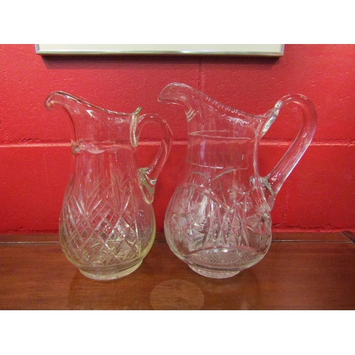 4134 - Two cut glass wash jugs, 32cm x 32cm