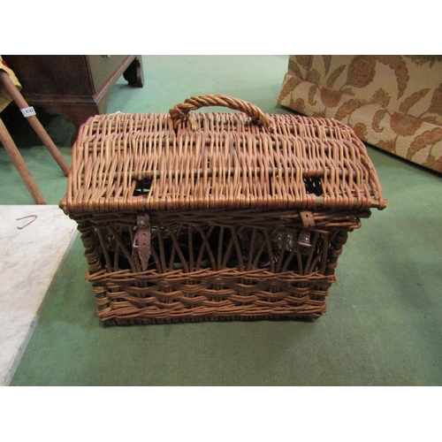 4161 - A wicker cat basket with Oriental clothing contents