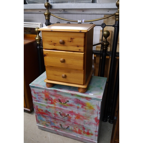 2330 - A graffiti effect painted chest of three drawers together with a modern pine bedside chest of three ... 