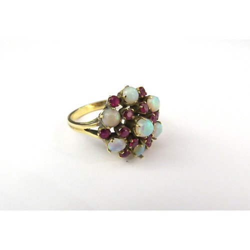 9223 - An opal and ruby cluster ring, stamped 585. Size L, 4.6g