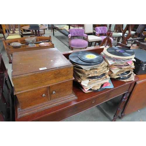 2207 - An oak cased record player and quantity of records