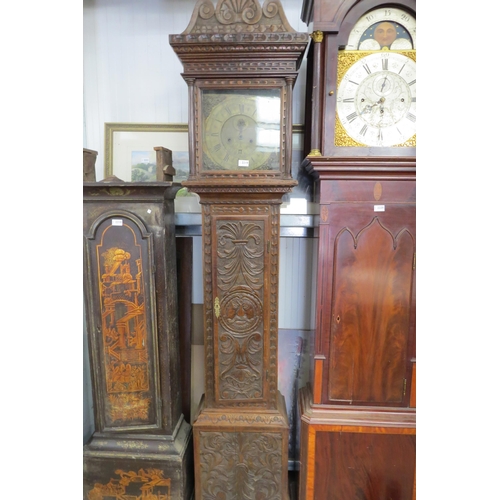 2219 - A 19th Century heavily carved oak Grandfather clock with brass dial, no weights, key or pendulum