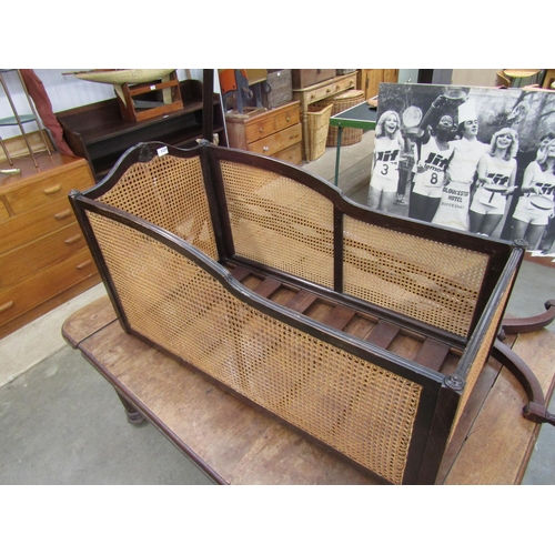 2229 - An early 20th Century mahogany swing cot with cane panels, stand a/f   (E)  £20-30