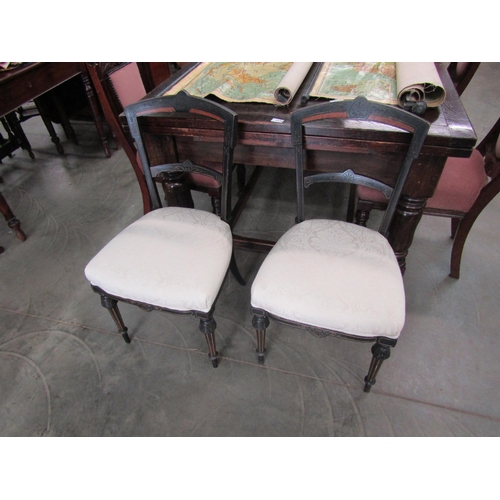 2238 - A pair of aesthetic ebonised with a burwood insert dining chairs