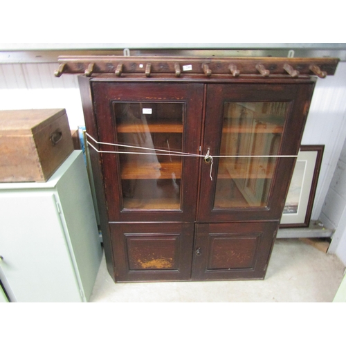 2264 - A Victorian stained pine four door cupboard, glazed top half