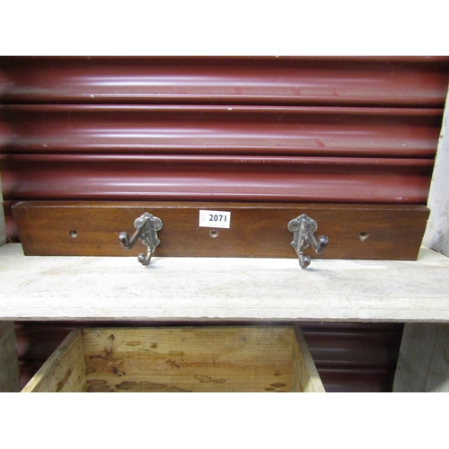 2071 - A Victorian mahogany coat rack with aesthetic movement cast iron hooks