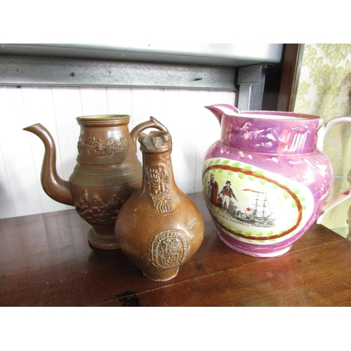 2106 - A Victorian lustre ware jug and two stoneware vessells