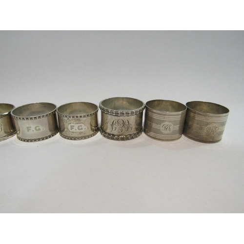 4311 - Three pairs of silver napkin rings and two singular examples (8)