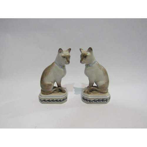 4312 - A pair of porcelain Siamese cat figures, 12.5cm tall