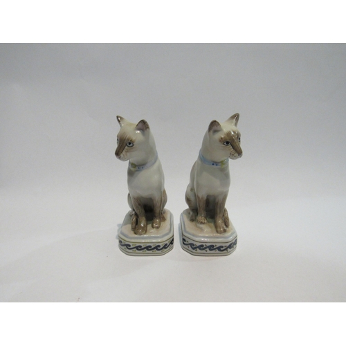 4312 - A pair of porcelain Siamese cat figures, 12.5cm tall