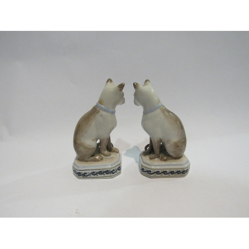 4312 - A pair of porcelain Siamese cat figures, 12.5cm tall