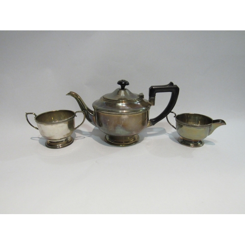 4325 - A Roberts & Dore Ltd. silver three piece teaset consisting of teapot, sucrier and milk jug, beaded d... 