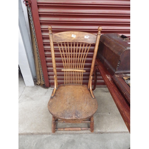 2377 - An Arts and Crafts oak spindle back nursing chair together with a rectangular top occasional table