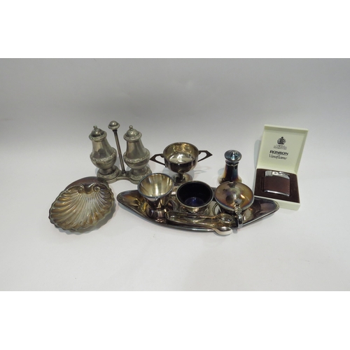 4416 - A box of mixed metalware including silver shell form dish and miniature trophy, together with an etc... 