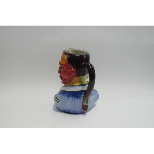 4428 - An Absente three face jug, 19cm high