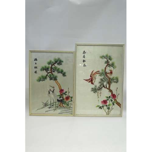 4451 - Five Oriental silk embroideries depicting birds amongst flowering trees, a/f two with cracked glass ... 