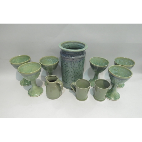 4458 - A green/blue glaze ceramic utensil jar, six similar goblets and a small green glazed jug with two co... 