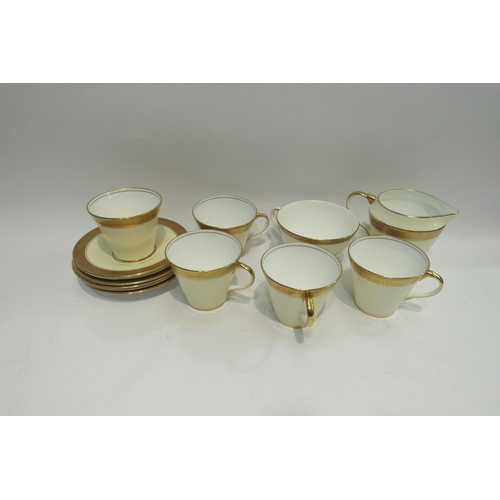 4460 - A Cauldon wash jug, four plates including Imari palette and Spode, cream and gilt banded tea wares i... 