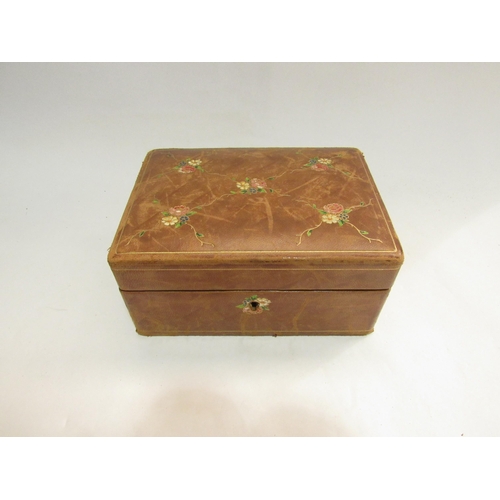 4079 - An early-mid 20th Century leather jewellery box with fitted interior, floral decoration, 8.5cm x 18c... 