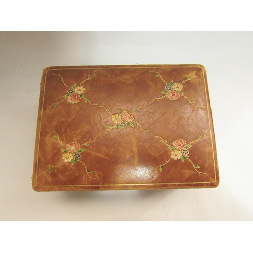 4079 - An early-mid 20th Century leather jewellery box with fitted interior, floral decoration, 8.5cm x 18c... 