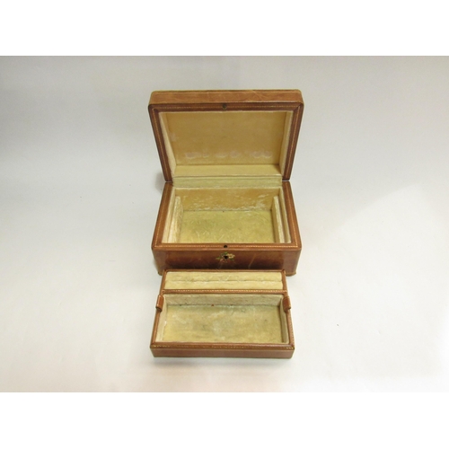 4079 - An early-mid 20th Century leather jewellery box with fitted interior, floral decoration, 8.5cm x 18c... 