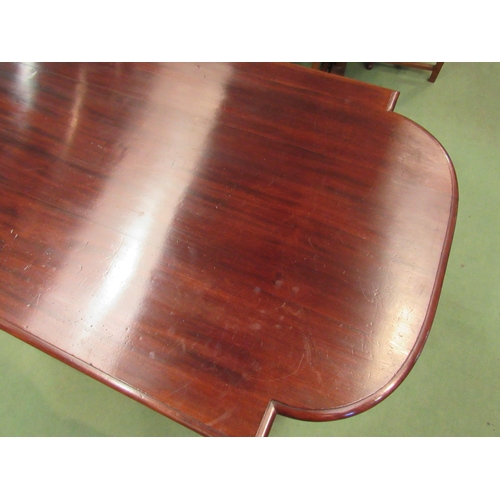 4098 - A mid Victorian mahogany library centre table, the breakfront top on turned and reeded legs with flu... 